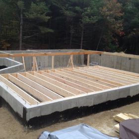 Floor joists installation begins.