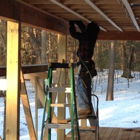 Work on the porch continues.