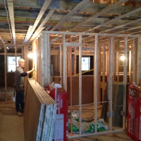 Preparing to install insulation and drywall.
