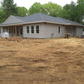 Right side view showing porch at the back of the house.