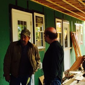 Construction Manager John Smith talks with one of the contractors.