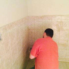 Completing accessible bathroom.