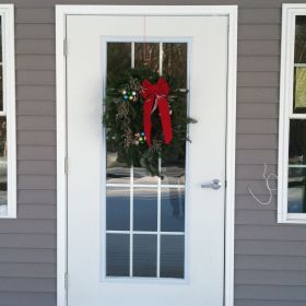 The front door is decorated for the season.