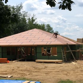 Roof sheathing going on another view.