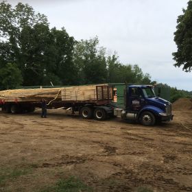 Roof truss unloading starts.