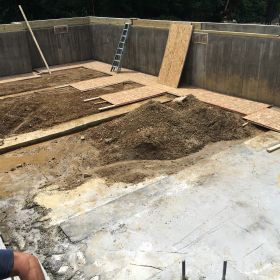 Inside view of basement with part of the floor completed.