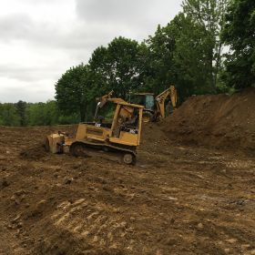 Clearing topsoil.