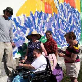 Representative Steve DiNatale, Caleb Neelon, Mary Heafy, and individuals from our day program join to paint a dot.